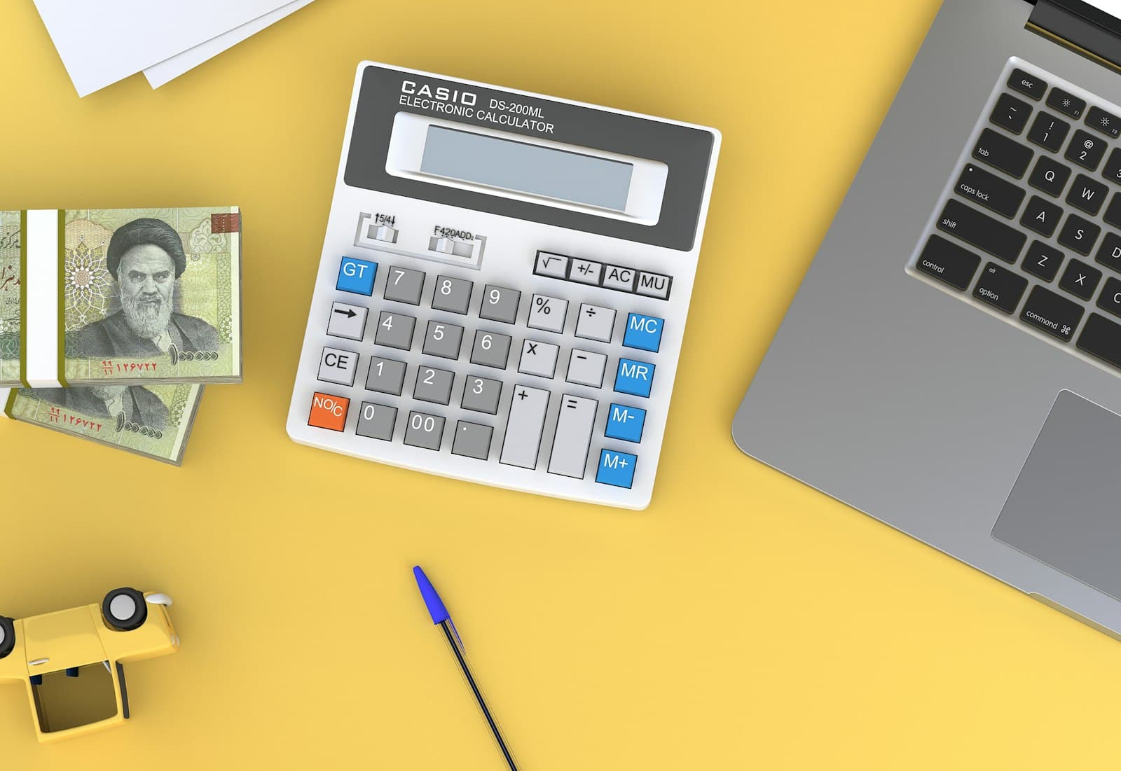 Expense tracker template spreadsheet with a calculator on a desk